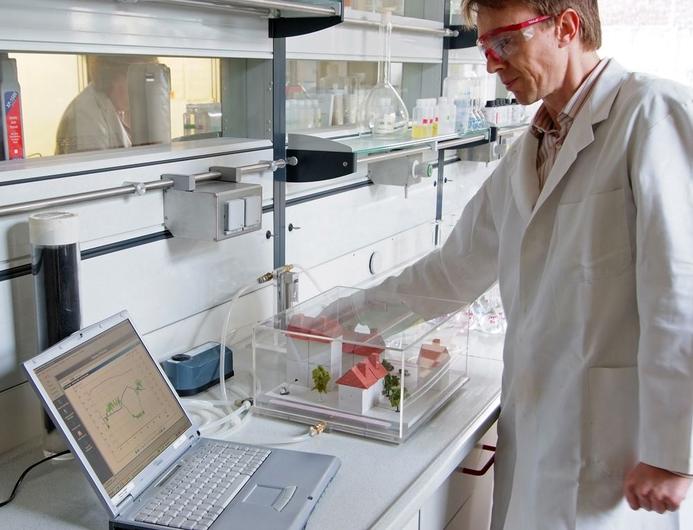 Lab technician conducting sustainability research at a modern laboratory bench