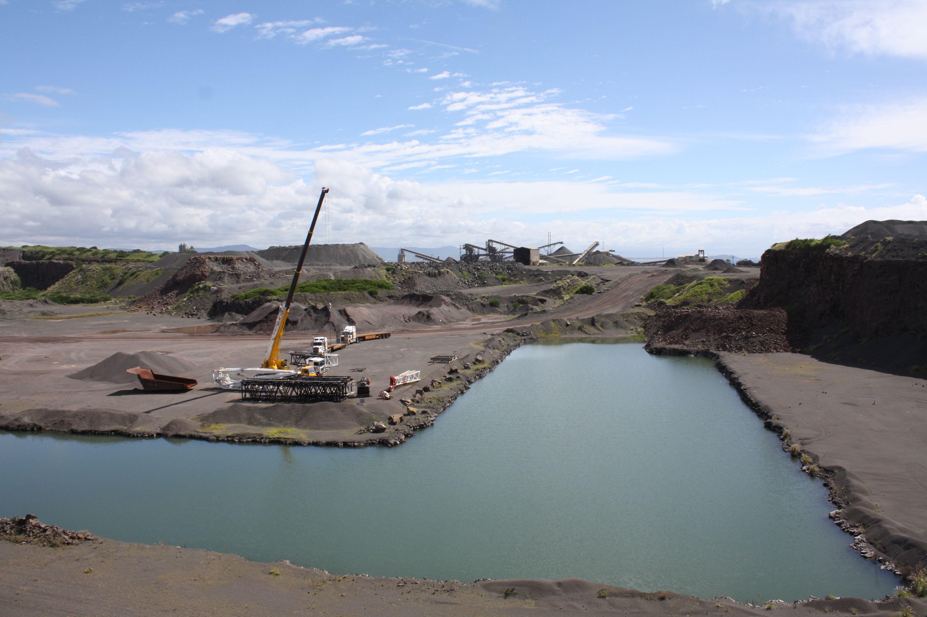 Coastal view of Bass Point with quarry operations nearby