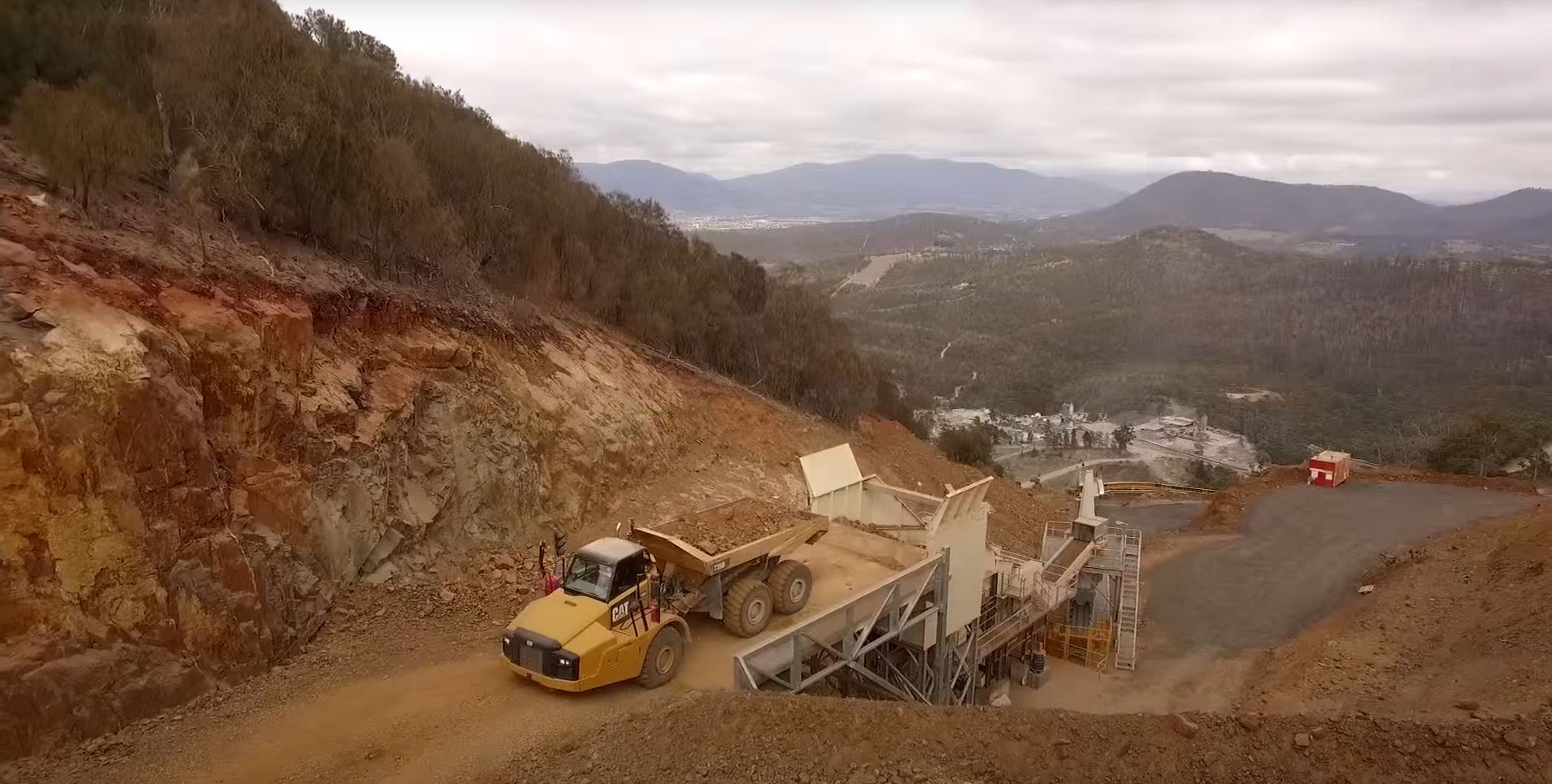 Open pit and vehicles at Flagstaff Gully Quarry