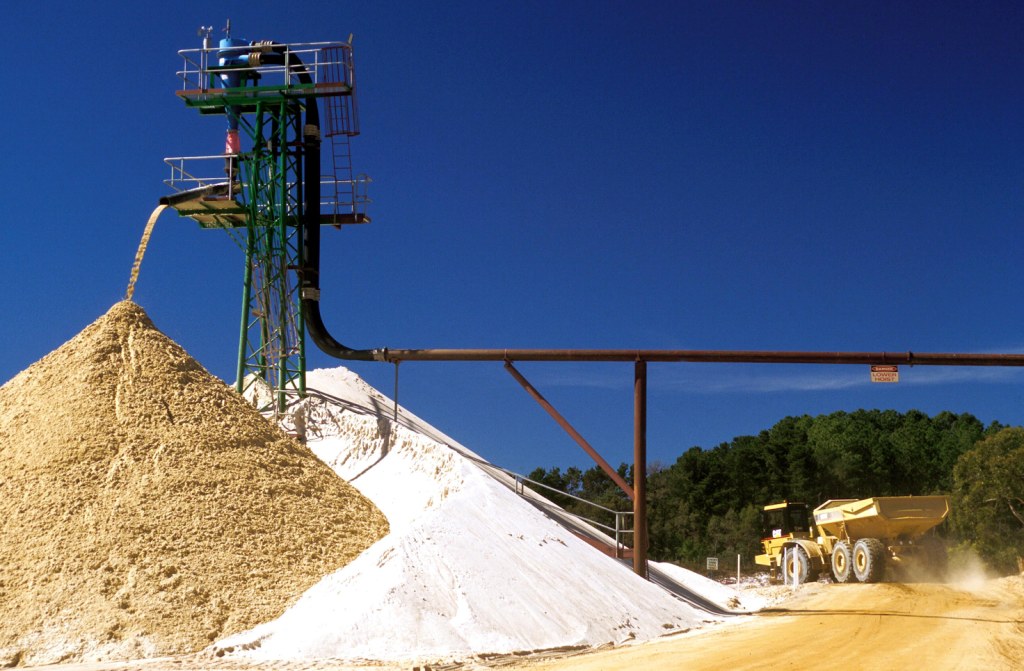 Stacked sand piles under clear blue sky in Perth