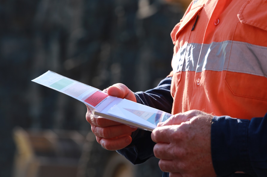 Safety Data Sheets holding by a worker onsite