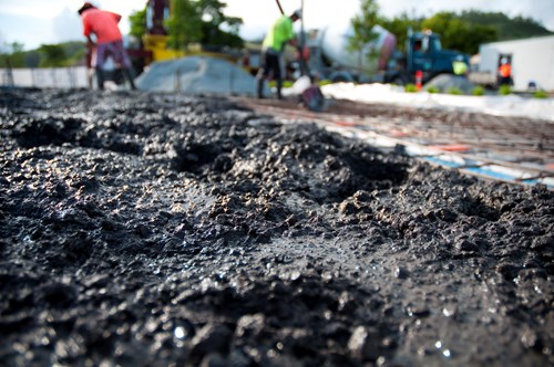 Concrete paving with exposed aggregate at a construction site