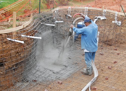Poolmasta shotcrete being applied to swimming pool formwork