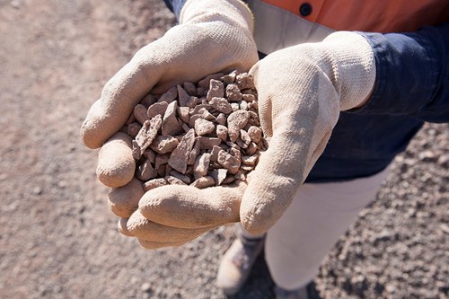 Hands displaying Engineered Fill aggregate product