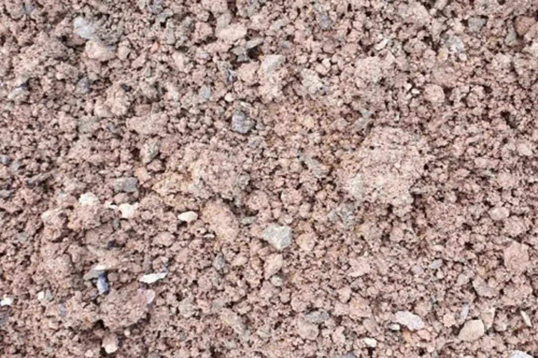 Close-up of bulk fill material with a mix of fine soil and small aggregates, used for backfilling, levelling and general construction earthworks.