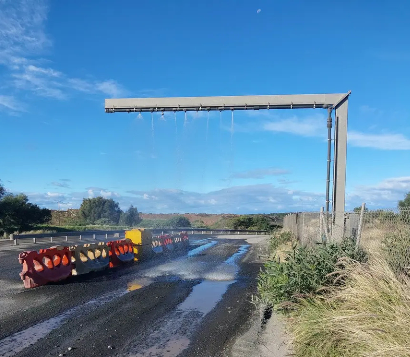 High-pressure spray system operating at Heidelberg Materials Australia’s Bass Point Quarry, helping manage dust and maintain site environmental controls along the quarry roadway.