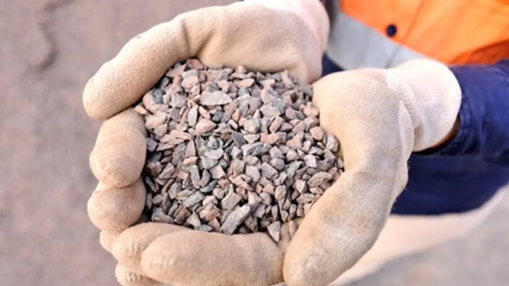 Person holding drainage aggregates in Heidelberg Materials Australia quarry